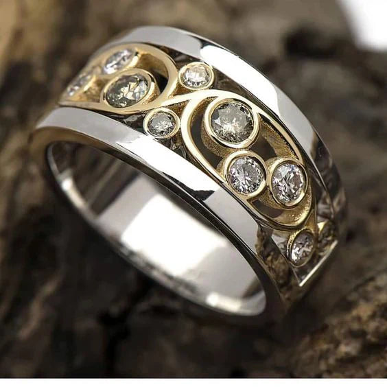 Vintage ring i guld og sølv med zirkon formet som vedbend