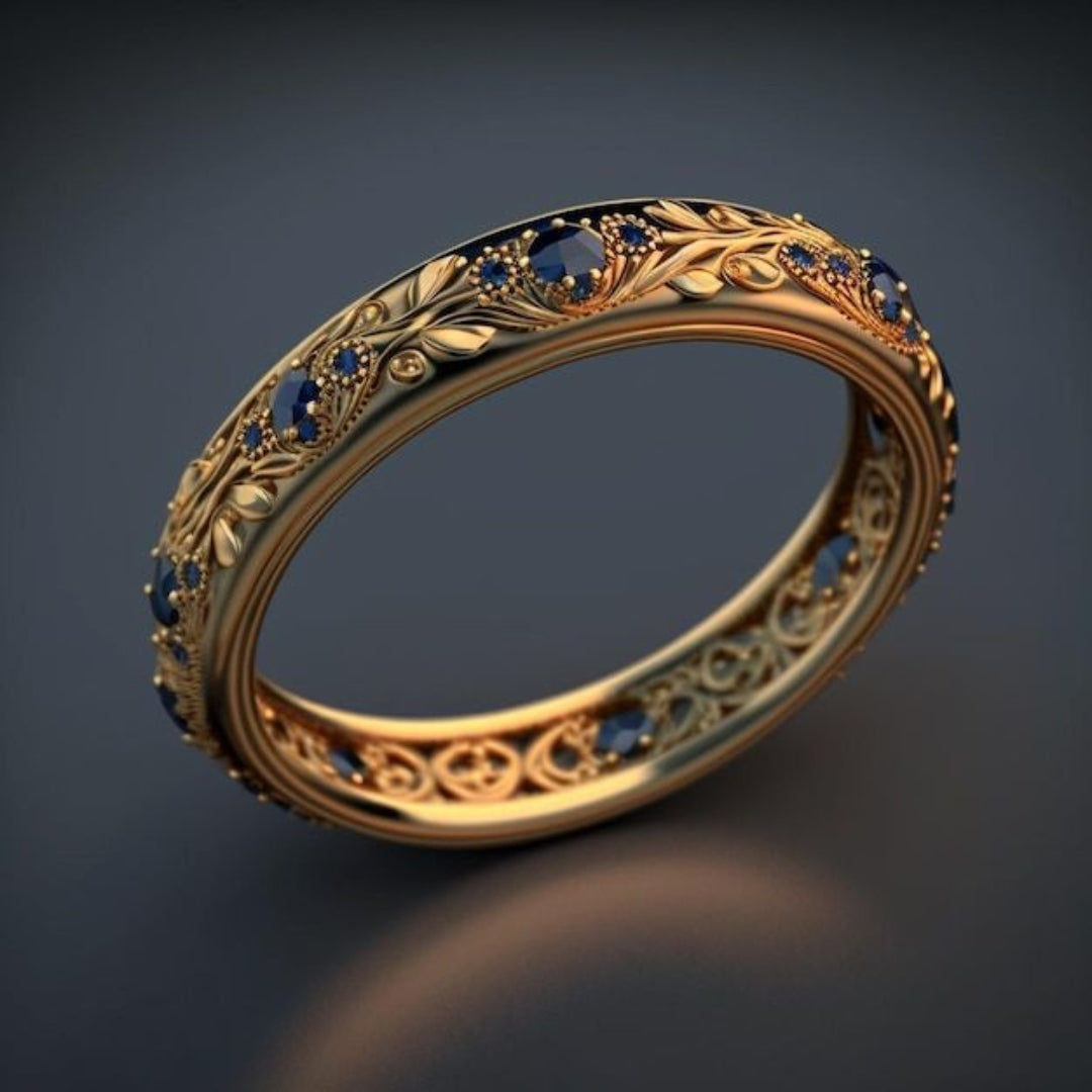 Eksotisk slank ring med et blad og blå zirkon