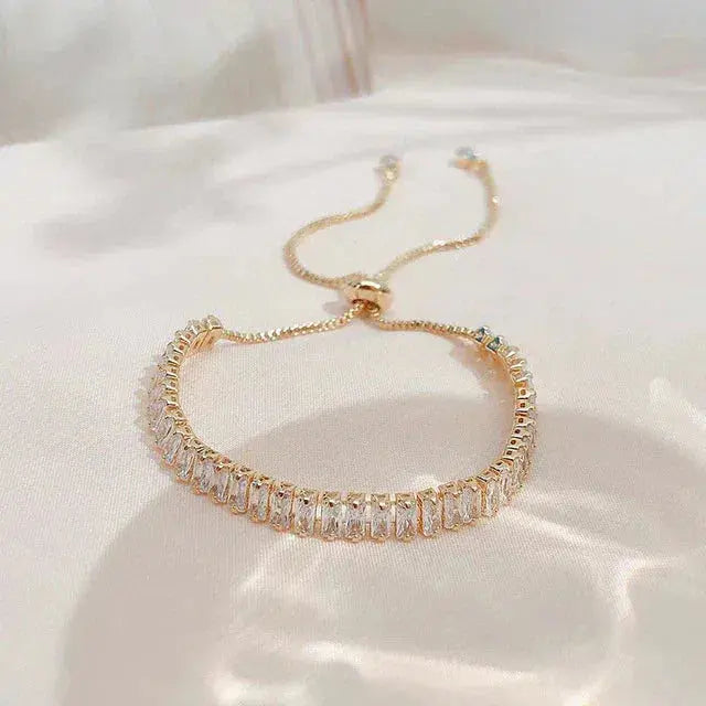 Justerbart armbånd med zirkon i guld og sølv