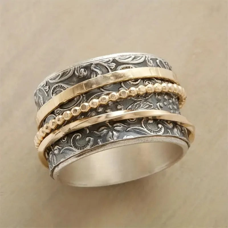 Vintage roterende ring med barokmønster